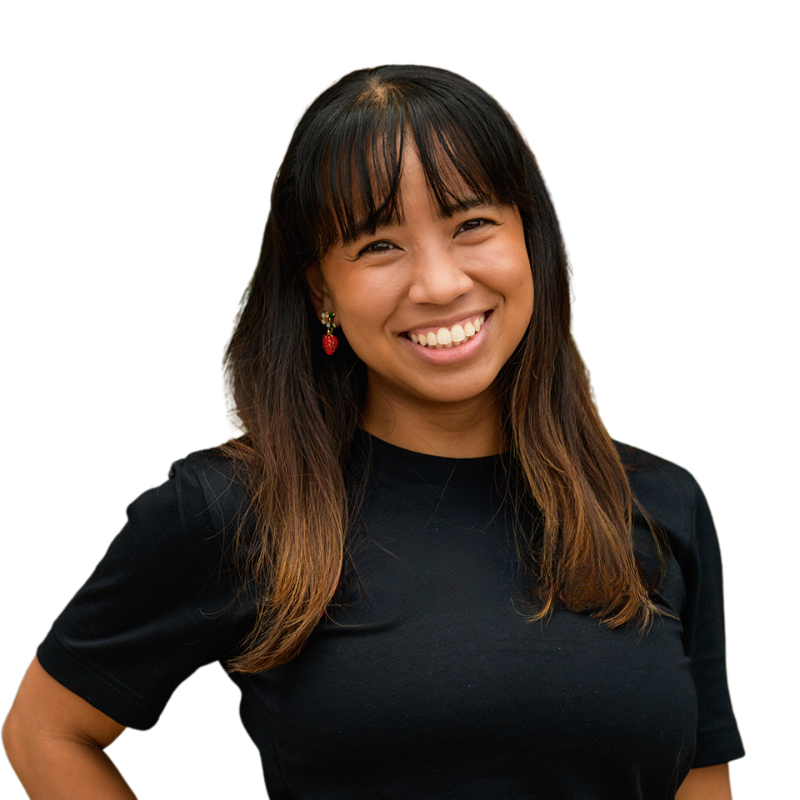 Rachel Madrigal smiling in front of a pink circle
